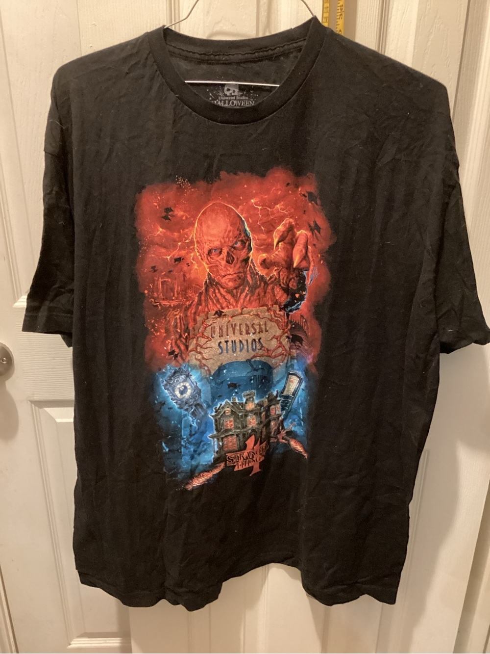 Universal Black Short Sleeve Graphic Tee with Red & Blue Horror Artwork